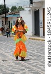 Small photo of XICO, VERACRUZ, MEXICO- JULY 20, 2013: Portrait of a man dressed with traditional costume during the festivities of Santa Maria Magdalena in Xico, Veracruz, Mexico