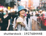 Small photo of Happy young adult asian foodie woman backpack traveler eating coconut juice. People traveling with lifestyle outdoor at China town street food market. Bangkok, Thailand
