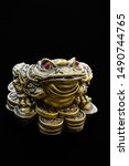 Golden three legged toad money sculpture