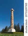 Small photo of Astoria, Oregon U.S.A. - April 15, 2021: The Astoria Column on a sunny day, on top of Coxcomb Hill, overlooking Astoria Bridge and the mouth of the Columbia River.