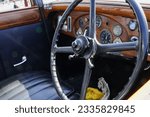 Small photo of Barry Island, Vale of Glam, Wales - June 11 2023: Close-up of the dashboard and interior of a Rolls-Royce in a vintage car exhibition. The brand still symbolises luxurious and affluence.