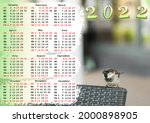 Calendar for 2022 with US holidays, Calendar with a picture of a sparrow. Calendar with a photo of a bird. Happy New Year 2022