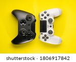 Black and White game controllers on yellow background
