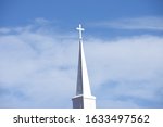 A white church steeple on a...