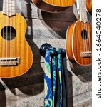 Small photo of ukulele. ukulele guitar portrait on the wall. musical instruments background with little guitar. musical instruments background with little ukulele. musical instruments making happy. little guitar.