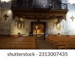Small photo of Toulouse, France - March 2023 - Back of the nave of Saint-Jerome's Sanctuary; the Baroque, 17th century chapel has wooden benches and features an entrance porch topped with an ancient balcony organ