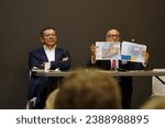 Small photo of Toulouse, France - Nov. 15, 2023 - Sitting next to Nicolas Bonleux, Chairman of Lignes Droites, ex-district attorney Patrice Michel shows a report of the Air and Border Police on irregular immigration