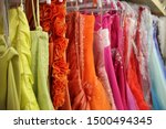 Rack of brightly coloured prom dresses