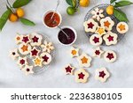 Traditional Linzer Christmas cookies filled with lingonberry jam and orange jam	
