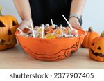 Woman holding a halloween candy ...