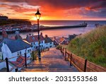 Small photo of Dramatic Sunset at Whitby after a shower on a Summer Evening. North Yorkshire, England, UK.
