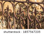 Rusty Iron Fence Bars  With A...