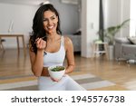 Young woman eating a healthy...
