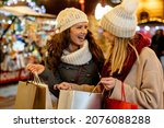 Portrait of cheerful young happy woman doing Christmas shopping. Christmas shopping people concept
