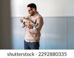 Portrait of young father holding his newborn baby. Fatherhood love single dad fathers day concept.