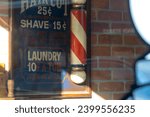 Small photo of Fort Mill, South Carolina, United States, 11 Nov 2020: The charm of downtown Fort Mill is encapsulated in the classic Barber Shop, where an old barber pole and vintage sign beckon.