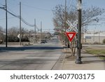 Small photo of Lancaster, South Carolina, United States, 31 Dec 2023: Downtown Lancaster, South Carolina, as a railroad and railroad crossing sign become integral parts of the cityscape.