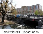 Small photo of Berlin, Germany - May 1, 2016: Former East Germany's State Council Building, currently houses the ESMT Berlin, Business School, view at Schleusen Bridge, in the forefront