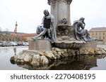 Small photo of Wurzburg, Germany - January 26, 2023: Sculptures of famous historical personae, at the Frankonianbrunnen, neo-baroque fountain on the Residenzplatz, in front of the Archbishopric Palace