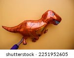 Small photo of Helium foil balloon in Dinosaur shape for party decorations