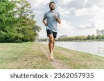 Small photo of Interval endurance training. Motivation and mental health playing sports. A professional running instructor in sneakers doing a workout alone. Young man fitness exercises.