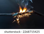 Flame Smoke And Sparks On An...