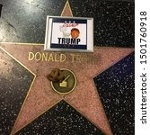 Small photo of Hollywood, Los Angles, USA - September 9th 2016: Donal Trump's star on the Hollywood Walk of Fame has a turd and a picture saying "Dump Trump" on it, just prior to his election.