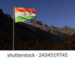 Small photo of beautiful tri-color indian national flag flying in the sky near bum la pass, india china international border (mcmahon line)