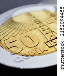 Small photo of Azerbaijani coin of 50 fifty qepiks closeup. Money of Azerbaijan. News about economy or currency. Loan and credit. Taxes and inflation. Azeri qepik coins. Vertical illustration. Macro