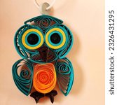 Small photo of Pune, India - June 12 2023: Quilled owl, paper quilling craft, beautiful paper quilled owl, colorful quill craft