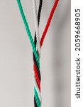 Small photo of UAE National day celebration concepts and elements. UAE flag color ropes twisted to connote 'togetherness' or 'strength of a nation'.