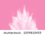 White powder explosion  on pink background. White dust splash cloud on pink background. 