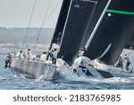 Small photo of Palma de Mallorca,Spain - July 26, 2022: The Platoon (right) and Quantum (left) hand-to-hand at the buoy crossing during the competition of the 52 SUPER SERIES Sailing Week hosted by Puerto Portals