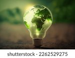 Green World Map On The Light Bulb With Green Background, Renewable Energy Environmental Protection, Renewable, Sustainable Energy Sources. Environmental Friendly. Renewable Energy 
