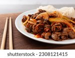Small photo of Whelk with somen with spicy sauce and vegetables