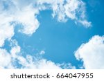 Cumulus humilis clouds in the blue sky, view from below