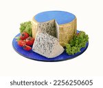 Wedge of blue cheese and large piece on blue plate. Clipping path.