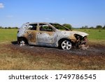 burnt out car in field. stolen... | Shutterstock . vector #1749786545