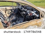 burnt out car in field  close... | Shutterstock . vector #1749786548