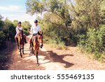Young Tourist Couple Horseback Riding