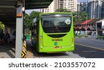 Small photo of SINGAPORE -8 JAN 2022: The Tower Transit public bus' sticker - "Please give way to buses" wrap advert on the top right corner of the back windscreen educates motorists to give way to buses.