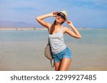 Small photo of Tourist woman at the Red Sea, Sharm el Sheik, Sinai Peninsula, Egypt.