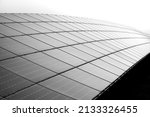Small photo of Solar cell panels mounted in a framework on a hilltop in Germany. Sunlight as a source of energy to generate direct current electricity – ecologic renewable power. Black and white greyscale gradient.