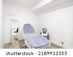 Small photo of Cabin with a chair covered with nonwoven fabric for medical use in a beauty clinic.