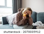 Long covid syndrome - increased fatigue, lack of strength, reduced immunity, memory problems and anosmia - loss of smell. Woman sniffs citrus fruits and does not smell