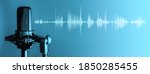 Small photo of Professional microphone with waveform on blue background banner, Podcast or recording studio background
