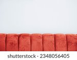 Close-up red sofa against white wall as background