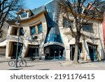 Small photo of SOPOT POLAND - May 2022 Crooked house on the main Monte Cassino street in Sopot, Poland. Crooked little house Polish: Krzywy Domek is an unusually shaped building. Irregularly-shaped, one of fifty