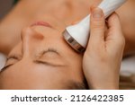 Small photo of Woman get facial hydro microderm abrasion peeling treatment therapy. Cosmetic beauty Spa salon. Hydra Vacuum Cleaner