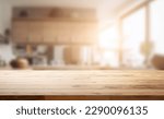 Empty beautiful wood table  top counter  and blur bokeh modern kitchen interior background in clean and bright,Banner, Ready for product montage